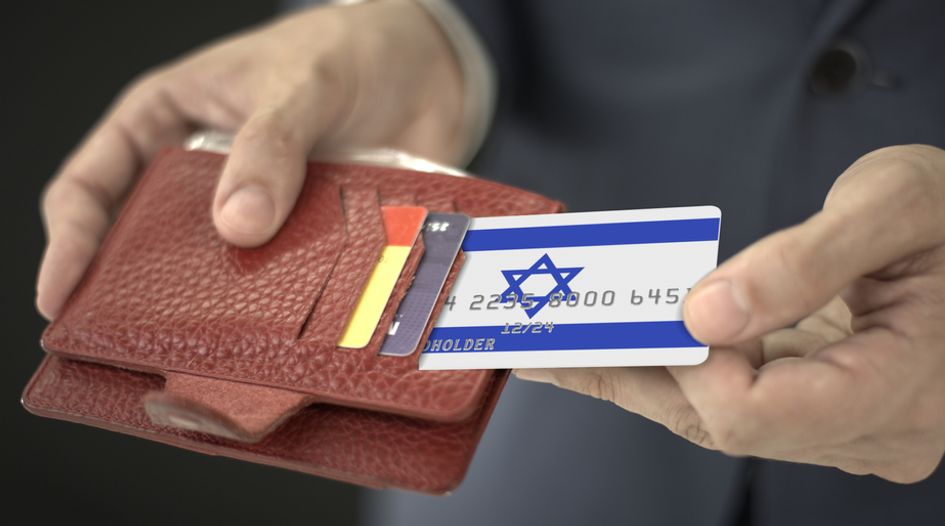 Israel conditionally clears credit card buyout