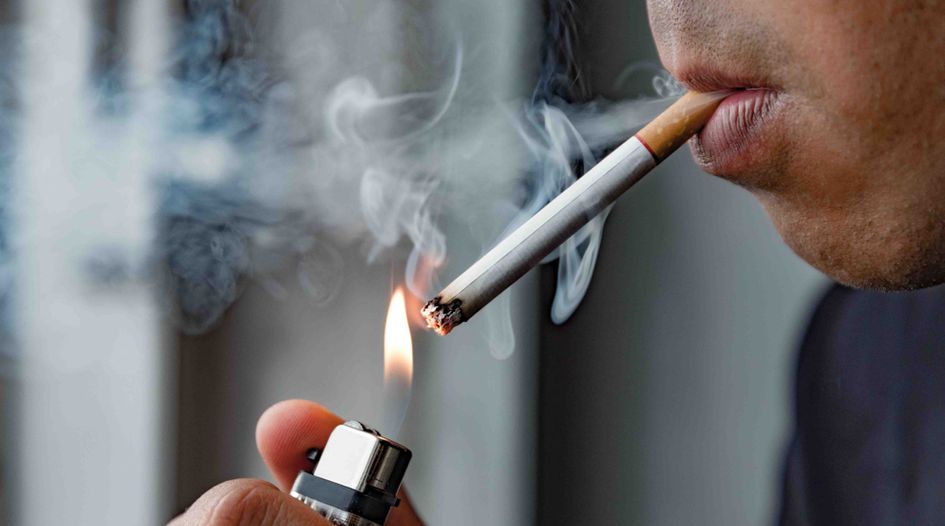 do long cigarettes have more tobacco Long cigarettes and a short cigarette Stock Photo
