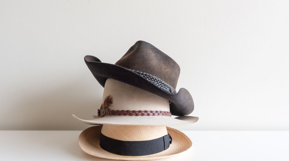 Double-hatting: prohibition or regulation?